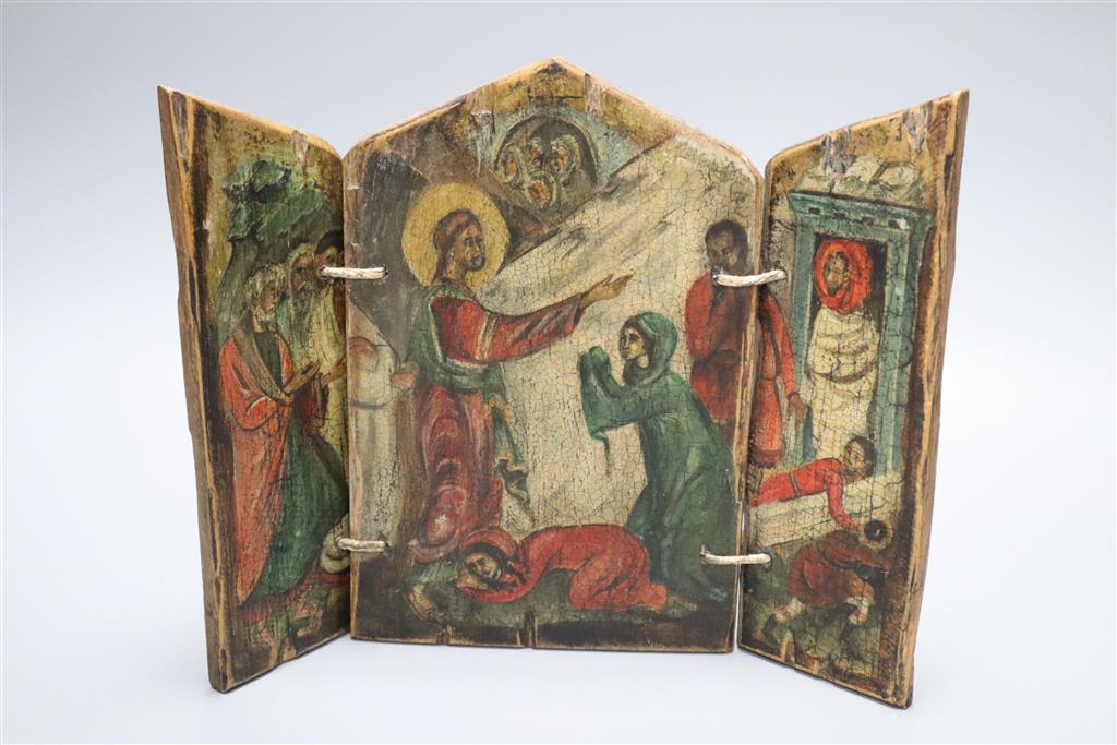 A small painted wood triptych, depicting the Raising of Lazarus in primitive style, height 25cm width 31cm